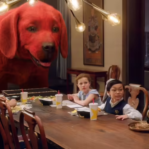 clifford the big red dog, eating with family at the table