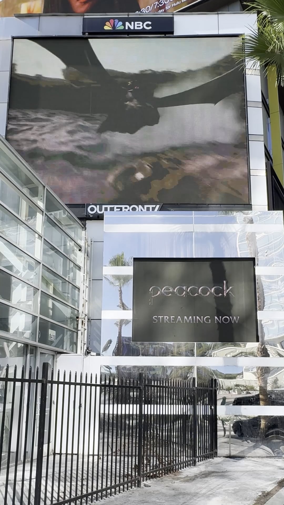 How to train your dragon large screen on side of peacock building